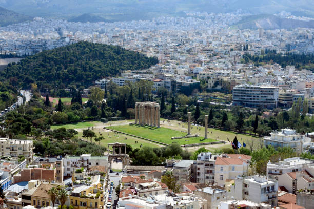 istock Ancient Greek ruins, ruins amidst lush green grass. Acropolis, Athens, Greece. 1163329849