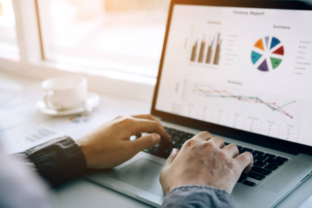 istock Investors are using laptop computers to analyze graphs in the morning. 1163330568