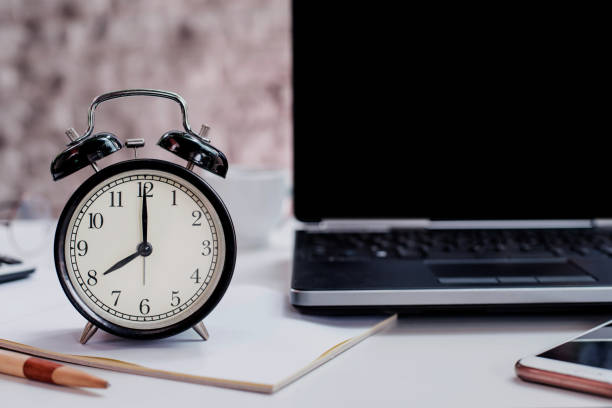 istock 8 O'clock. Time to work and business concet. Black background and copy space on laptop. 1163330721