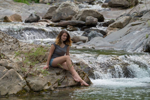 istock Woman by the river 1163331805