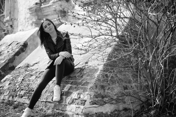 istock Girl on a walk through the spring city 1163331819