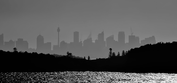 Sydney skyline. Atmospheric conditions made this perfect outline and almost complete black and white photo. BW was finalized in edit.