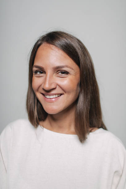 istock Portrait of a smiling woman 1163334366