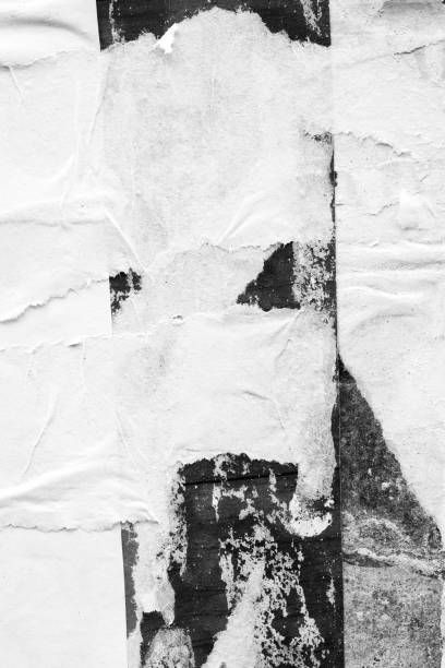 istock Blank white black old ripped torn paper crumpled creased posters grunge textures backdrop backgrounds placard 1163334636