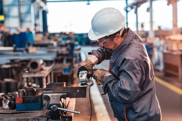 istock Worker cutting metal at the factory. 1163335341