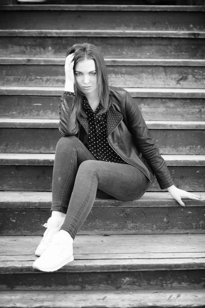 istock Girl on a walk through the spring city 1163335606