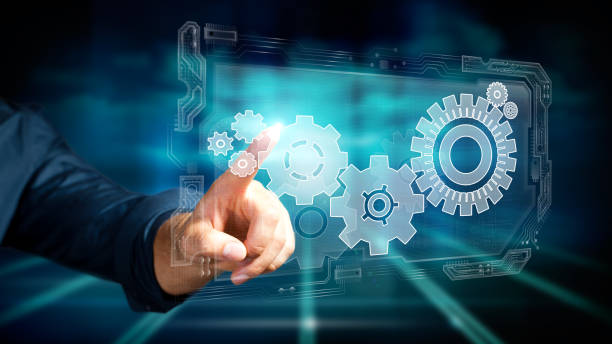 istock business man pressing a specific cog wheel to keep the system running 1163335722