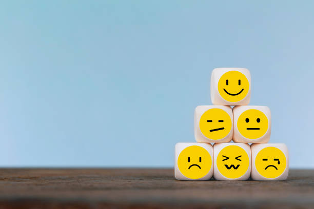 istock Emoticon icons face on Wooden Cube , Costumer service concept 1163339325