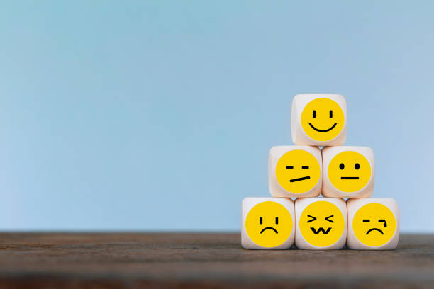 Emoticon icons face on Wooden Cube , Costumer service concept stock photo