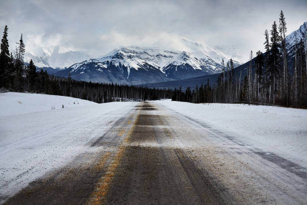 istock Snowy winter road in the National Park 1163339792