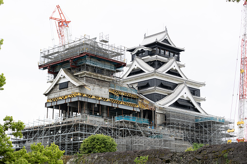 Kumamoto, Japan - May 1, 2019 : Landscape of historic fortress construction site under maintenance or renovation at Kumamoto Castle.