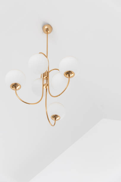 istock electric sphere lamp or chandelier hanging from ceiling with copyspace. 1163342158