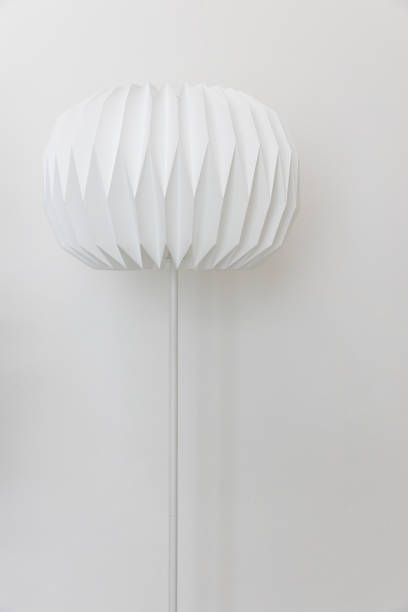 istock The single unique round shape paper electric floor lamp on white wall background. 1163342199