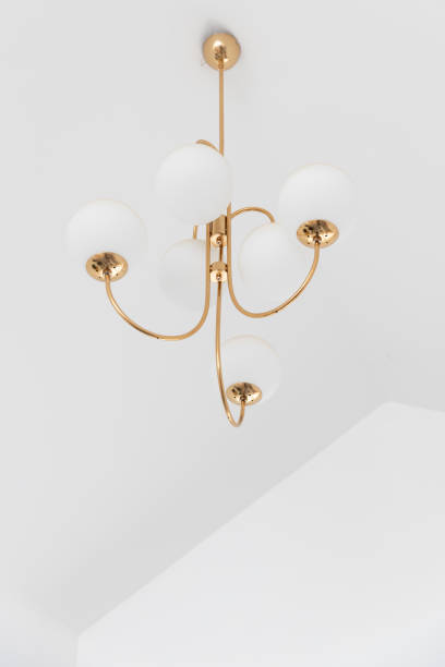 istock electric sphere lamp or chandelier hanging from ceiling with copyspace. 1163342365