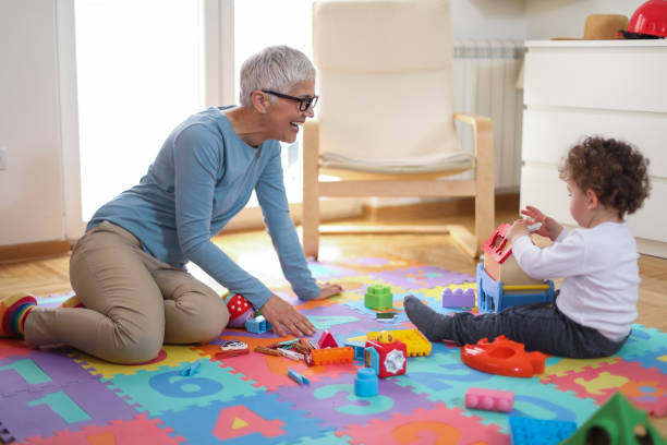 istock Grandmother playing with her grandson 1163343439