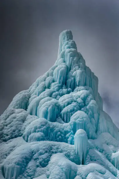 A man made structure, locally called the Ice Stupa rises up dramatically against the winter skies in India's Ladakh region. The ice stupa is a water conservation method using winter's cold weather to freeze flowing water and using it in the summer.