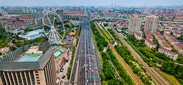 Panoramic view of Shanghai Jinjiang Park area, elevated highway interchange and Ferris Wheel