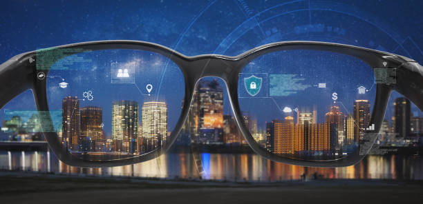 istock Smart glasses, VR virtual reality, and AR augmented reality technology. Smart glasses looking at the city with graphic hologram 1163347188