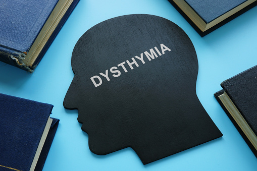 Persistent depressive disorder PDD dysthymia written on a head shape.