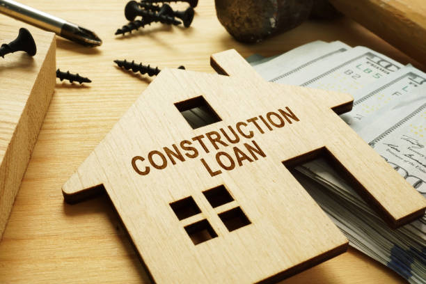 istock Construction loan concept. Model of home, hammer and screwdriver. 1163347462