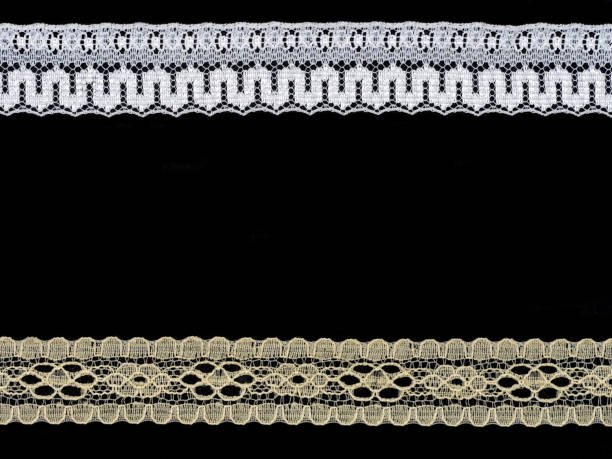 istock White and beige laces on black background. Lacework concept 1163348170