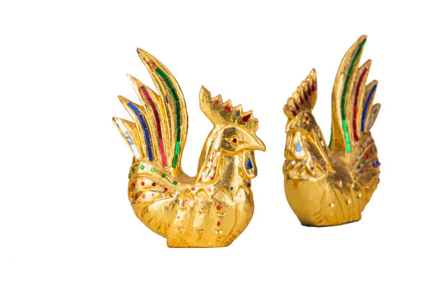 istock Golden chicken statue isolated with white background 1163352394