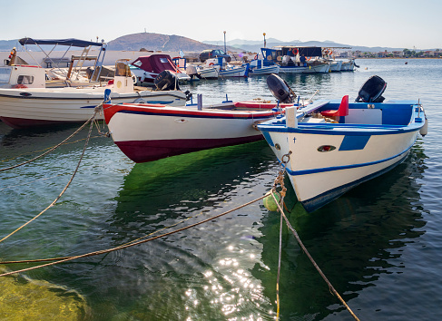 Fishing boat on a sunny afternoon on the calm Aegean Sea on the island of Evia, Greece