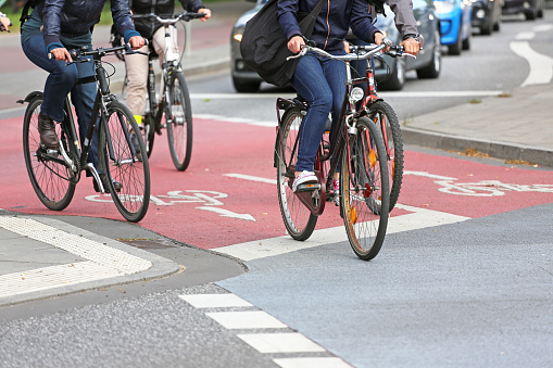 cyclists on red cycle lane