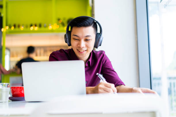 istock Asian millennial working indoors 1163358243