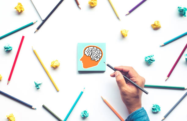 Ideas inspiration concepts with drawing brain in head on notepaper background Ideas inspiration concepts with drawing brain in head on notepaper background.Business creativity.human performance man with a light bulb over his head stock pictures, royalty-free photos & images