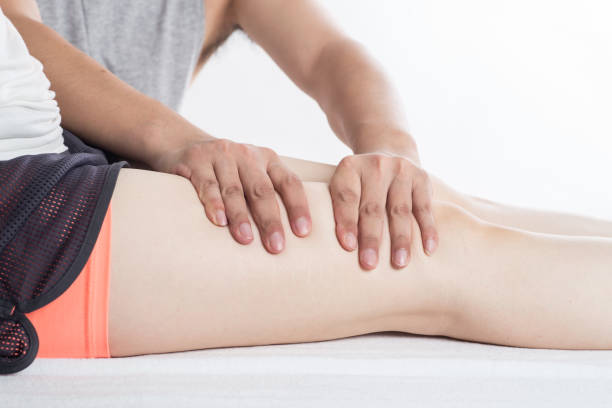 istock Close-up of female hands doing foot massage 1163358330