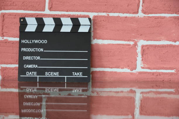 istock Clapper board in the background of Red brick wall 1163359424