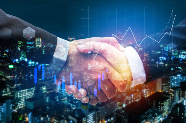 business man handshake with graph chart of stock market investment trading for Forex trading and night cityscape background, digital technology, internet communication, teamwork, partnership concept apretón de manos de hombre de negocios con gráfico de comercio de inversión en el mercado de valores para el comercio de forex y fondo urbano nocturno, tecnología digital, comunicación por internet, trabajo en equipo, concepto de asociación