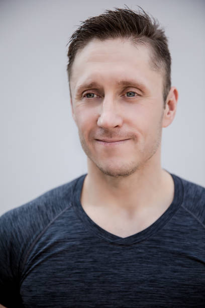 istock Sporty man in gray t-shirt portrait 1163359607