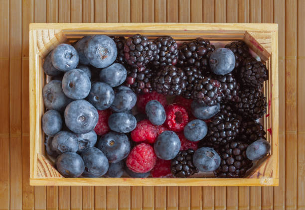 istock Raspberries, cherries, blueberries, and blackberries. 1163360516