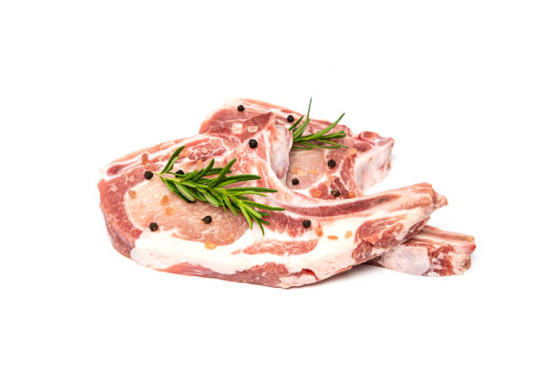istock Slice raw pork chop with herb and spices isolated on white background 1163364775