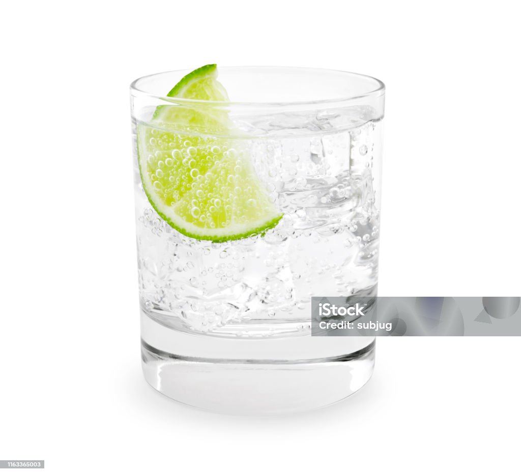 Gin Tonic Gin tonic with lime slice isolated on white Gin Tonic Stock Photo