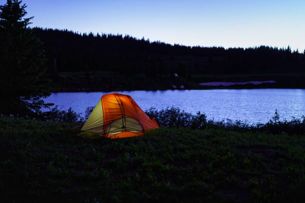 istock Tent Glowing at Dusk Mountain Lake 1163366241