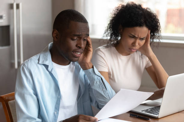 istock Couple use ebanking read letter having financial problems feels unhappy 1163367371