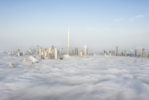 Cityscpae of Dubai Downtown skyline on a foggy winter day. Dubai, UAE.