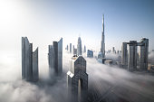 Dubai Downtown skyline on a foggy winter day.