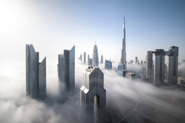 Dubai Downtown skyline on a foggy winter day. Cityscpae of Dubai Downtown skyline on a foggy winter day. Dubai, UAE. dubai stock pictures, royalty-free photos & images