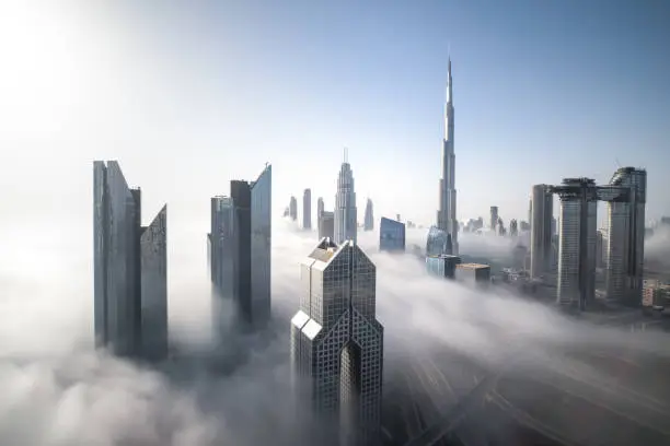 Cityscpae of Dubai Downtown skyline on a foggy winter day. Dubai, UAE.