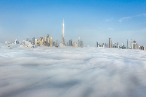 Cityscpae of Dubai Downtown skyline on a foggy winter day. Dubai, UAE.