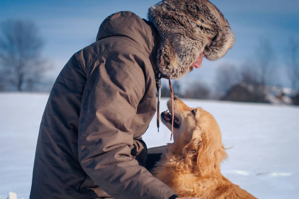 istock Man hiker and his dog on a mountain top 1163368829