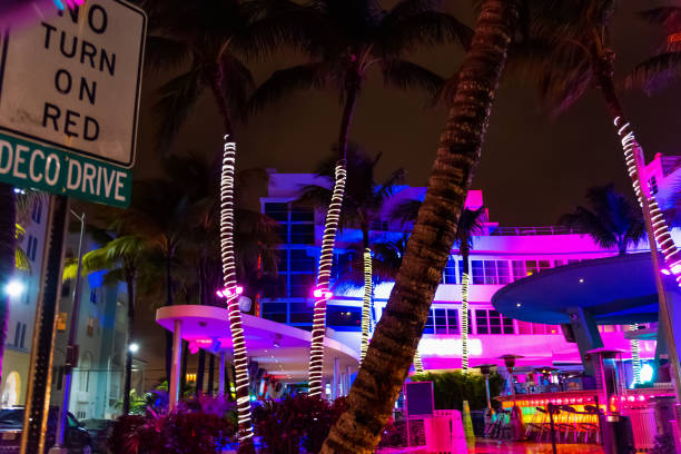 istock Colorful buildings and palm trees in Miami Beach at night 1163369949