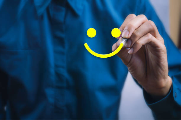Conceptual the customer responded to the survey. The client using digital pen white happy face smile icon. Depicts that customer is very satisfied. Service experience and satisfaction concept. Conceptual the customer responded to the survey. The client using digital pen write happy face smile icon. Depicts that customer is very satisfied. Service experience and satisfaction concept. loyalty stock pictures, royalty-free photos & images