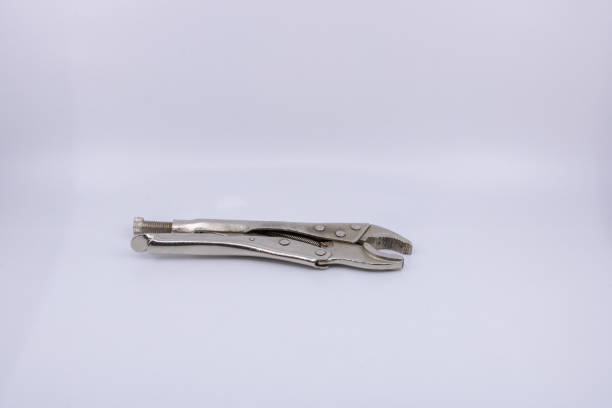 istock clamp for plumber and mechanic - isolated object on white background for construction professionals and sale of DIY equipment 1163379368