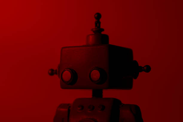 istock Silhouette portrait of a cute robot on a red background. 1163390849