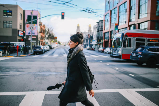 istock Young commuter woman in San Francisco Mission District 1163391419